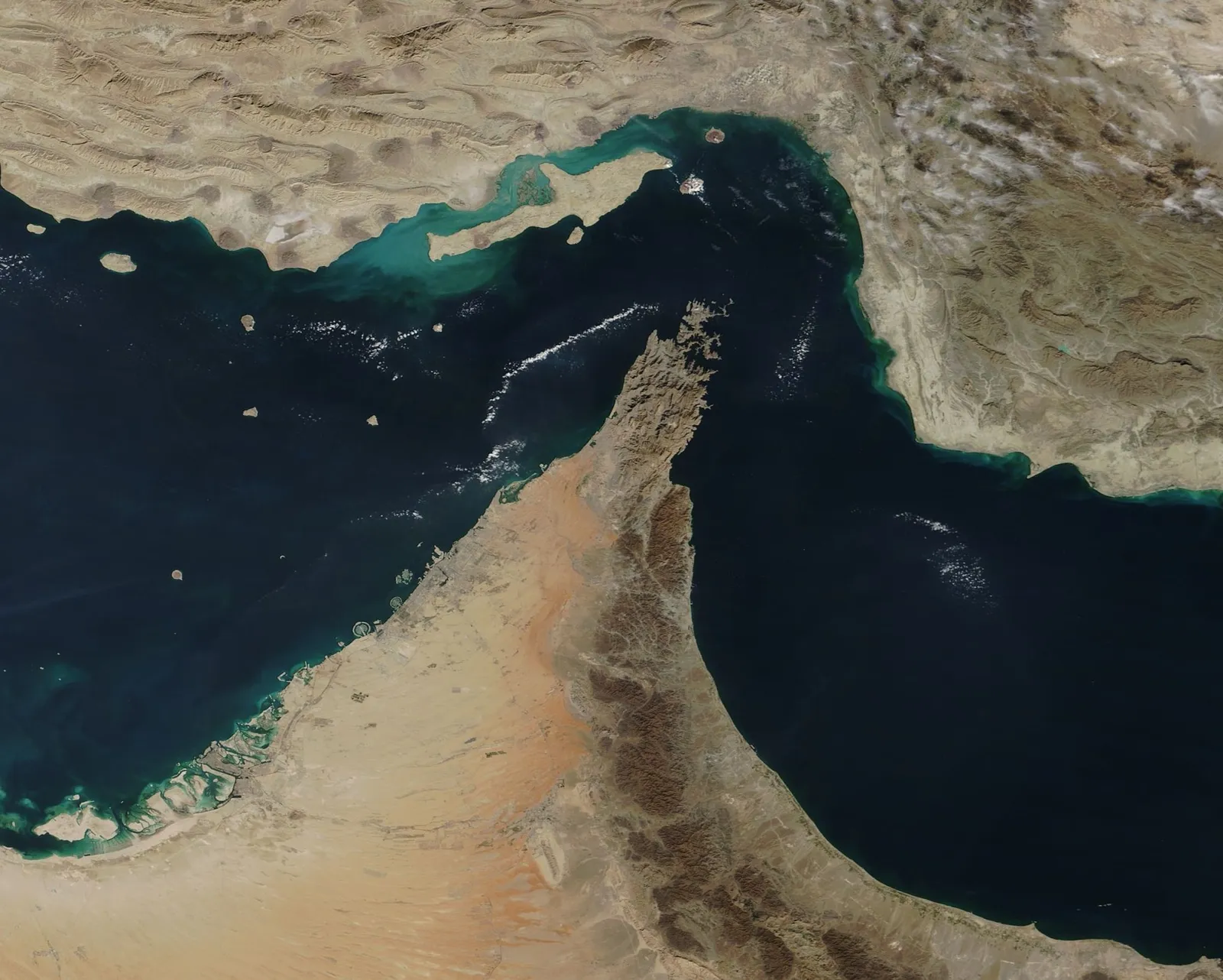 Satellite photo of the narrow Strait of Hormuz between Iran to the north and the Musandam Peninsula of Oman to the south.